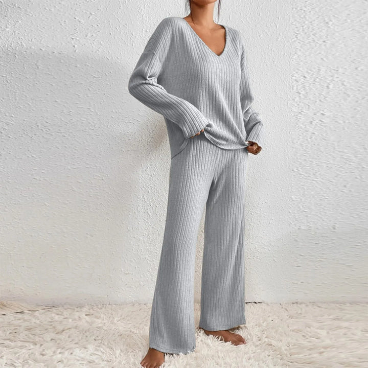Woman wearing elegant casual knit 2-piece lounge set outdoors. Versatile women's loungewear for comfort.