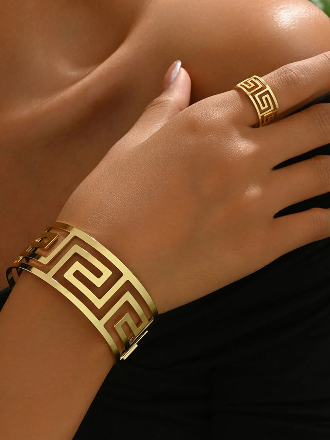 Geometric 18K gold-plated cuff bracelet and ring for women. Bold design, elegant fashion accessory.