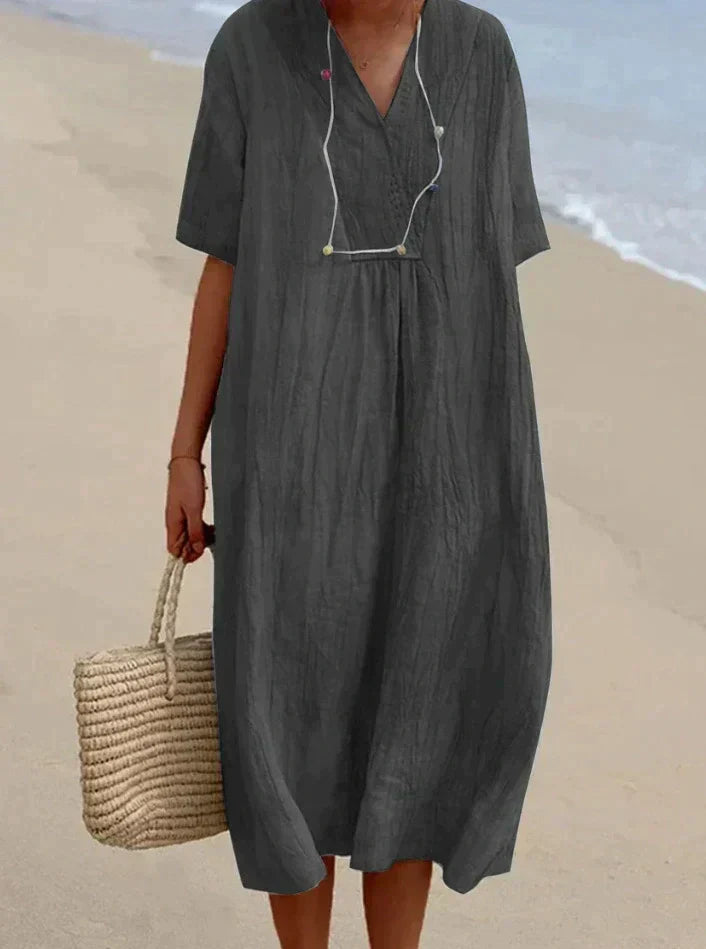 Versatile cotton linen A-line women's dress; a comfortable V-neck summer style suitable for any casual or elegant occasion.