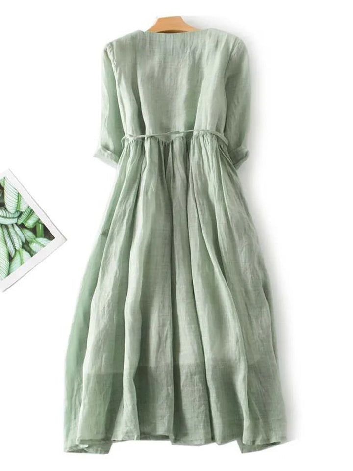 Amara women's elegant flower dress. Flattering retro midi style, perfect for summer casual elegance & party wear.