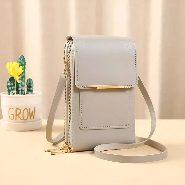 Front view: Women's anti-theft crossbody bag showcasing secure design & sleek profile for travel.