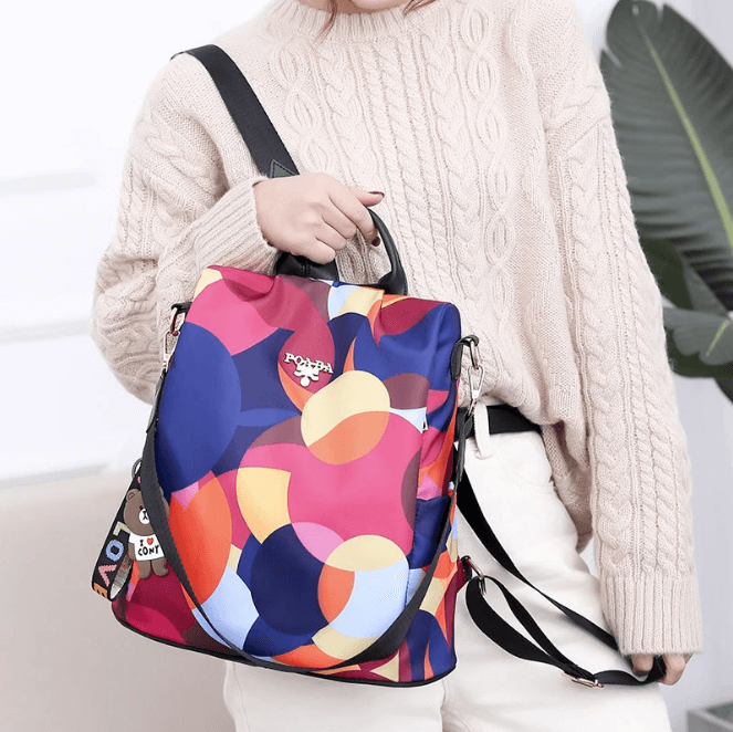 Versatile women's anti-theft water-resistant backpack, organized for laptop, travel, and daily use.