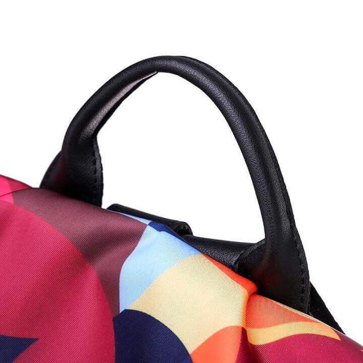 Front view of a women's anti-theft water-resistant backpack, sleek design, secure for daily wear.