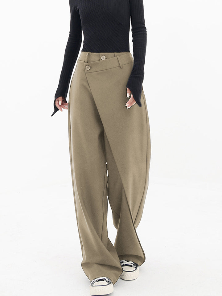 Women's high-waisted asymmetrical pants, relaxed fit with elegant draped detailing for modern style.