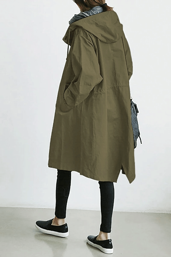Packable Women's Aurora travel jacket: a lightweight, hooded windbreaker offering stylish rain protection.