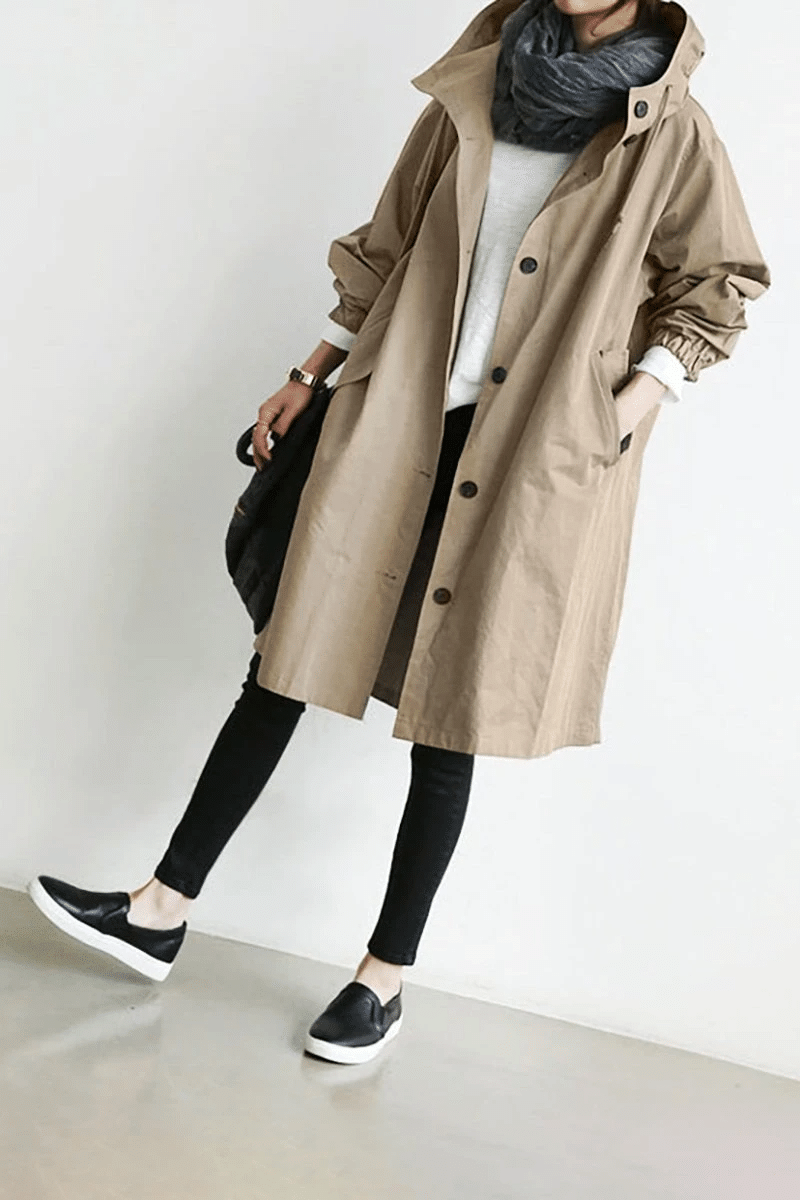 Versatile Women's Aurora windbreaker, a lightweight hooded jacket for all-weather style & comfort.