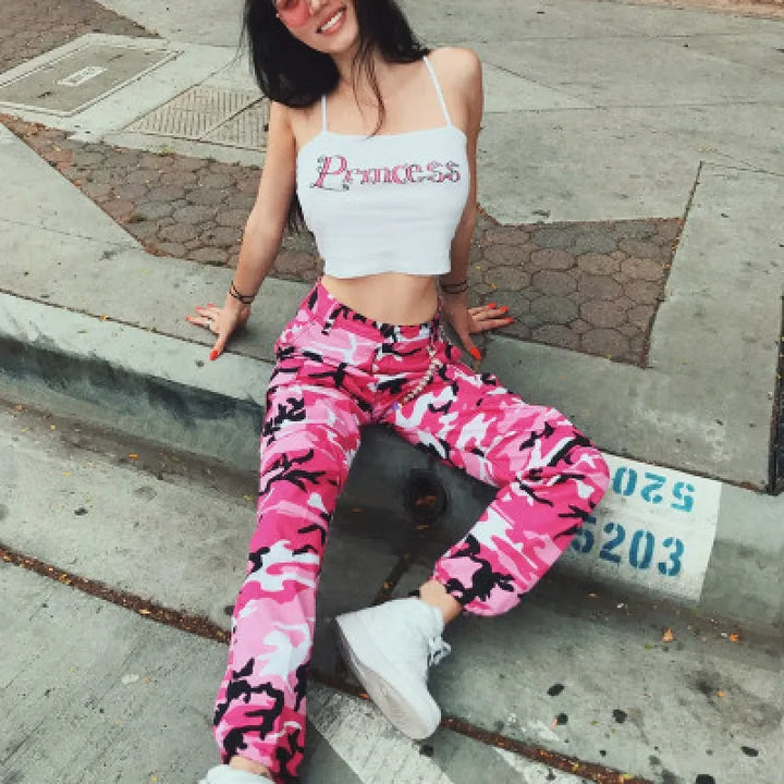 Colorful camo print women's baggy cargo pants with ankle cuffs, a trendy statement piece for streetwear fashion.