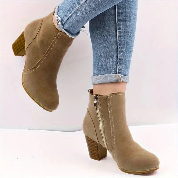 Stylish women's ankle boots featuring a comfortable block heel & side zip, perfect for fall fashion.