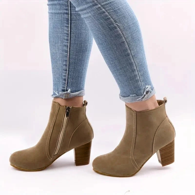 Fashionable women's block heel ankle boots with convenient side zip, ideal for winter & everyday wear.