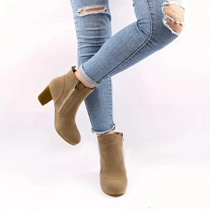 Versatile women's dress ankle boots with sturdy block heel & easy side zip, suitable for any occasion.
