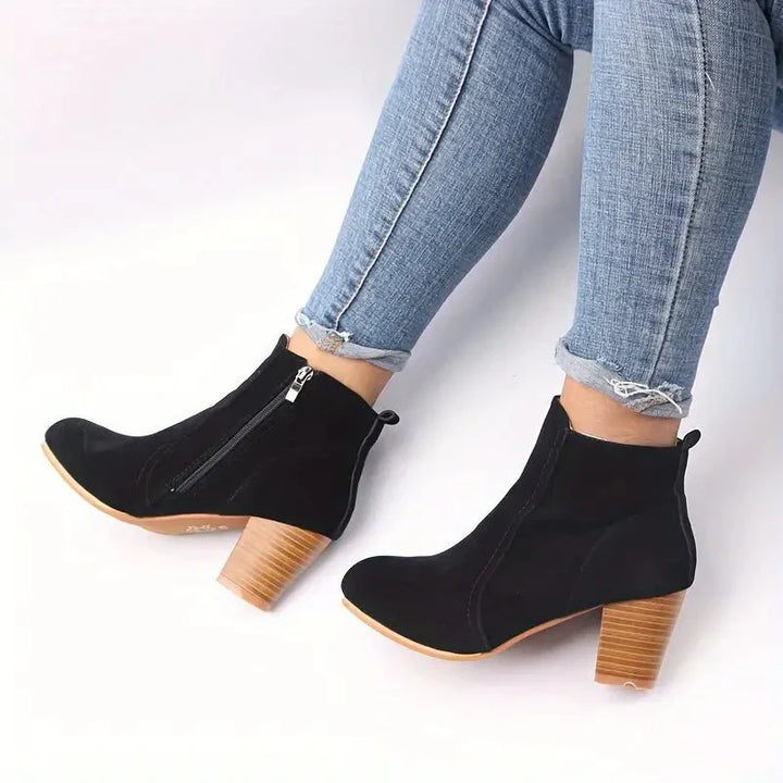 Modern women's block heel ankle boots with side zip, offering a blend of style, comfort & versatility.
