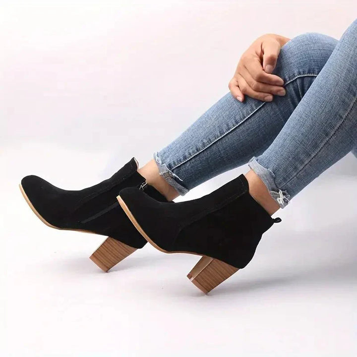 High-quality women's block heel ankle boots, designed with a side zip for both fashion and convenience.