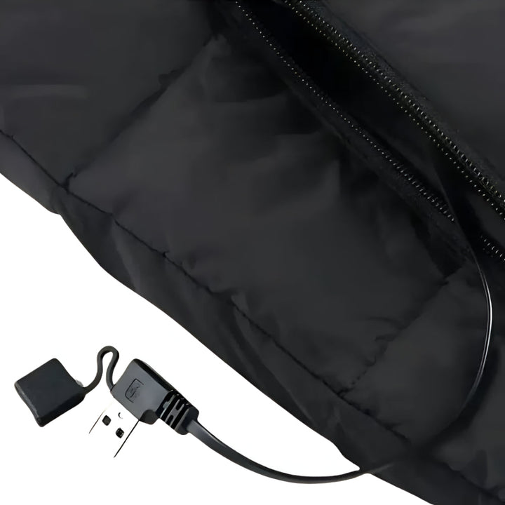 Stylish women's heated vest in charcoal grey, delivering reliable electric warmth for cold outdoor gear.