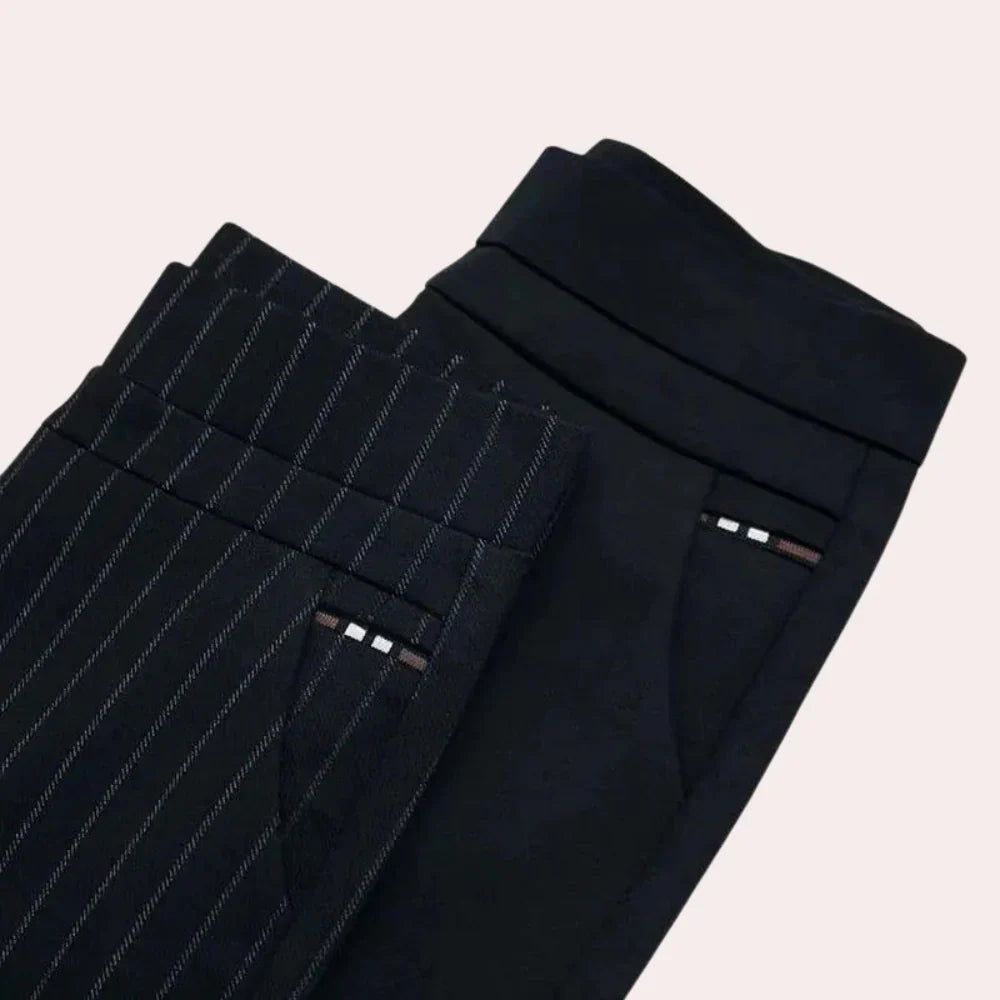 Close-up of women's comfortable high-waisted black stretch trousers, highlighting the elastic waistband.