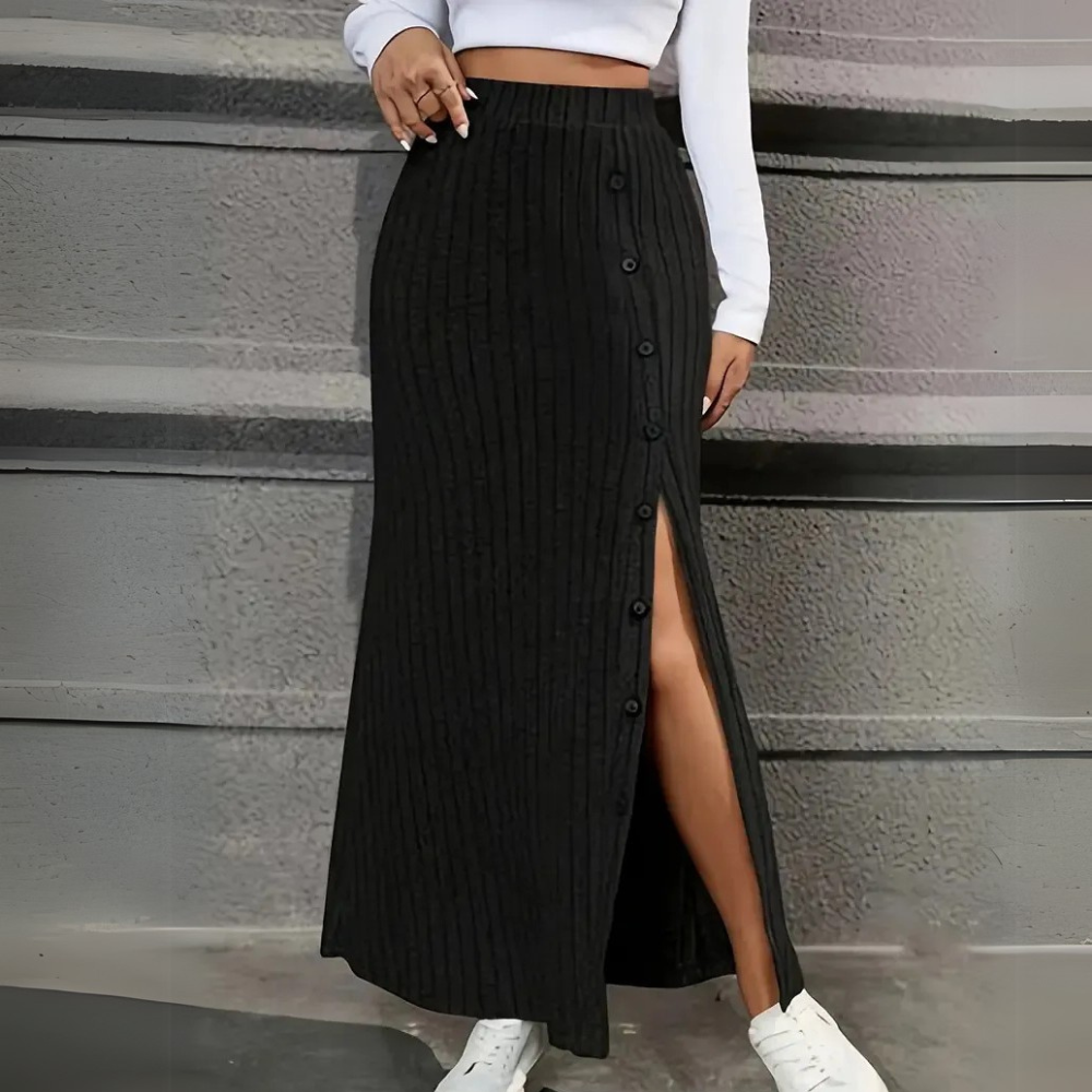 Women's black long fitted maxi skirt with elegant side slit and button detail, perfect for versatile wear.