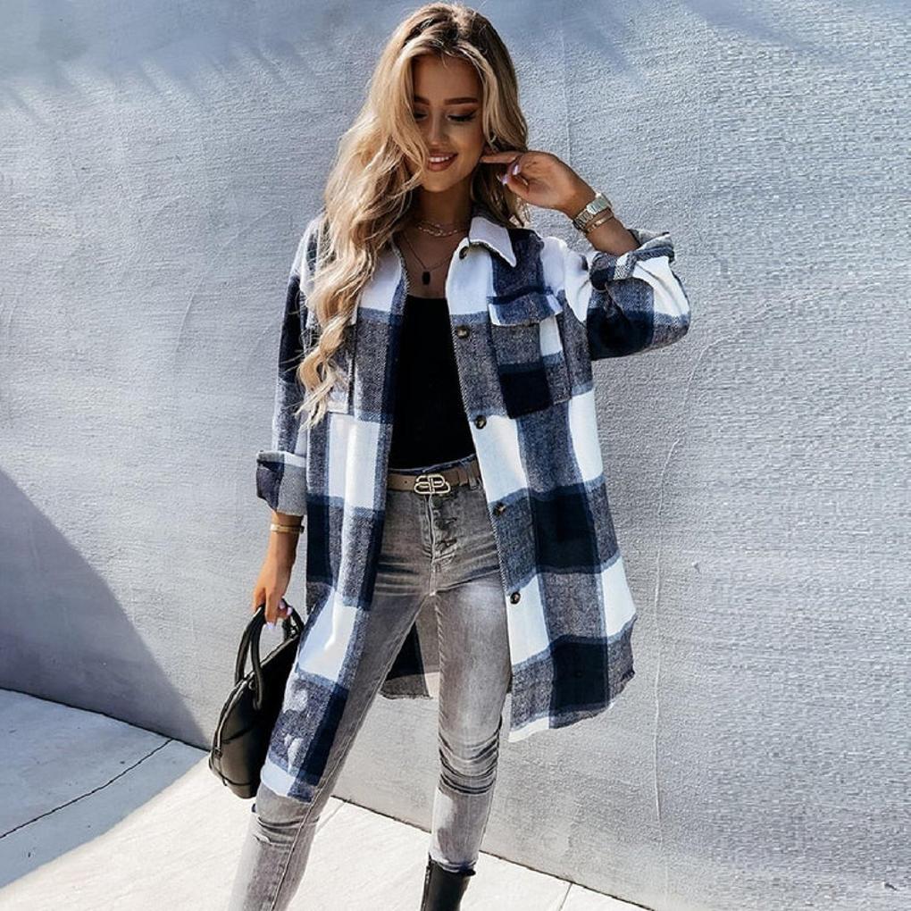 Women's blue utility jacket with practical pockets, adjustable fit. Chic fashion outerwear for versatile casual layering.