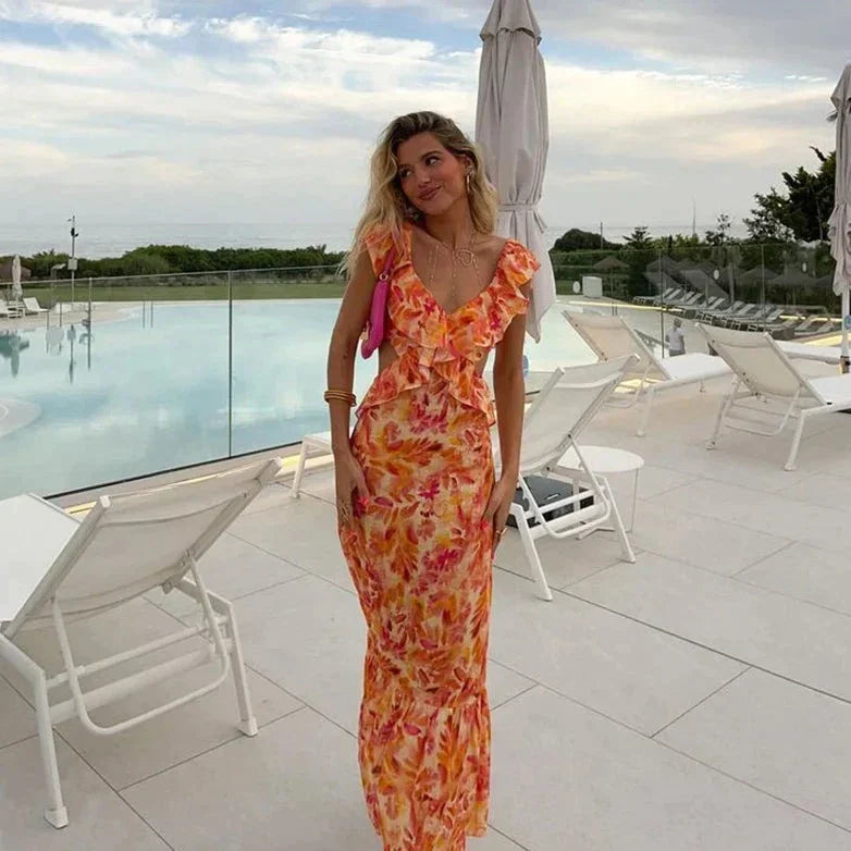 Women's bohemian print dress with elegant ruffles, V-neck, & batwing sleeves; ideal for summer casual chic.