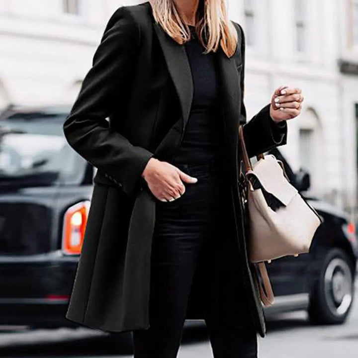 Elegant women's winter trench coat with a bohemian touch, a chic and warm outerwear option.