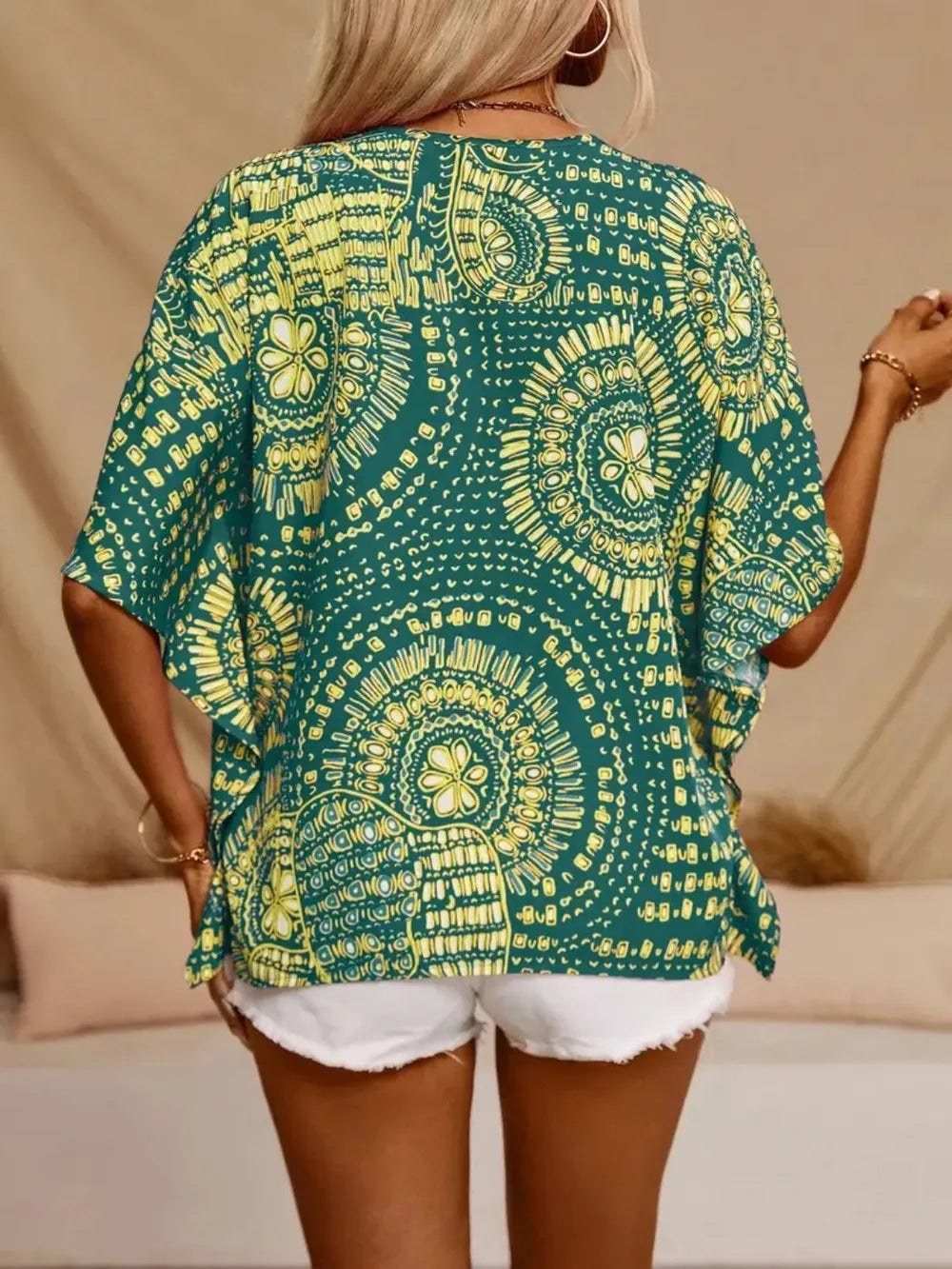 Lightweight women's boho V-neck blouse, featuring a stylish printed design.