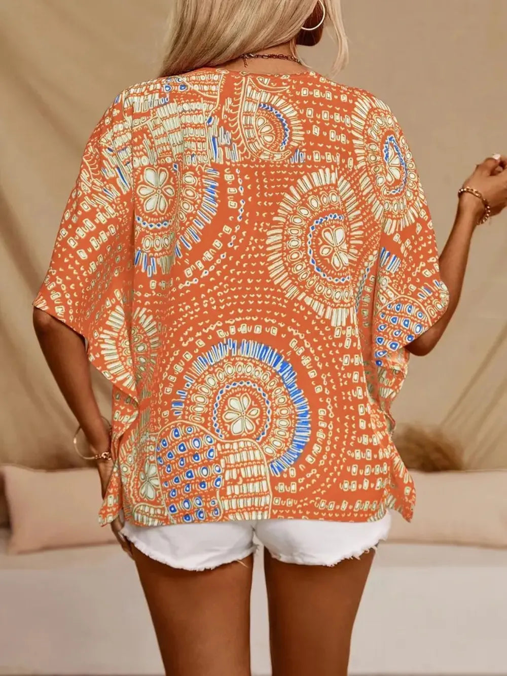 Vibrant women's boho V-neck shirt, comfortable flowy fit and unique print.