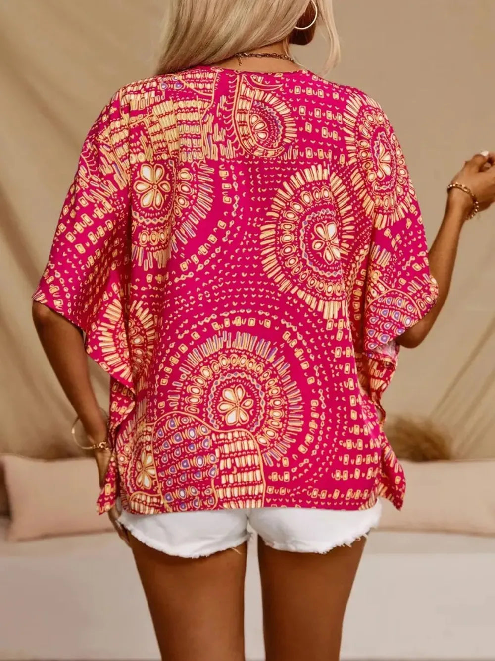 Stylish women's printed boho blouse with a flattering V-neck, casual fit.