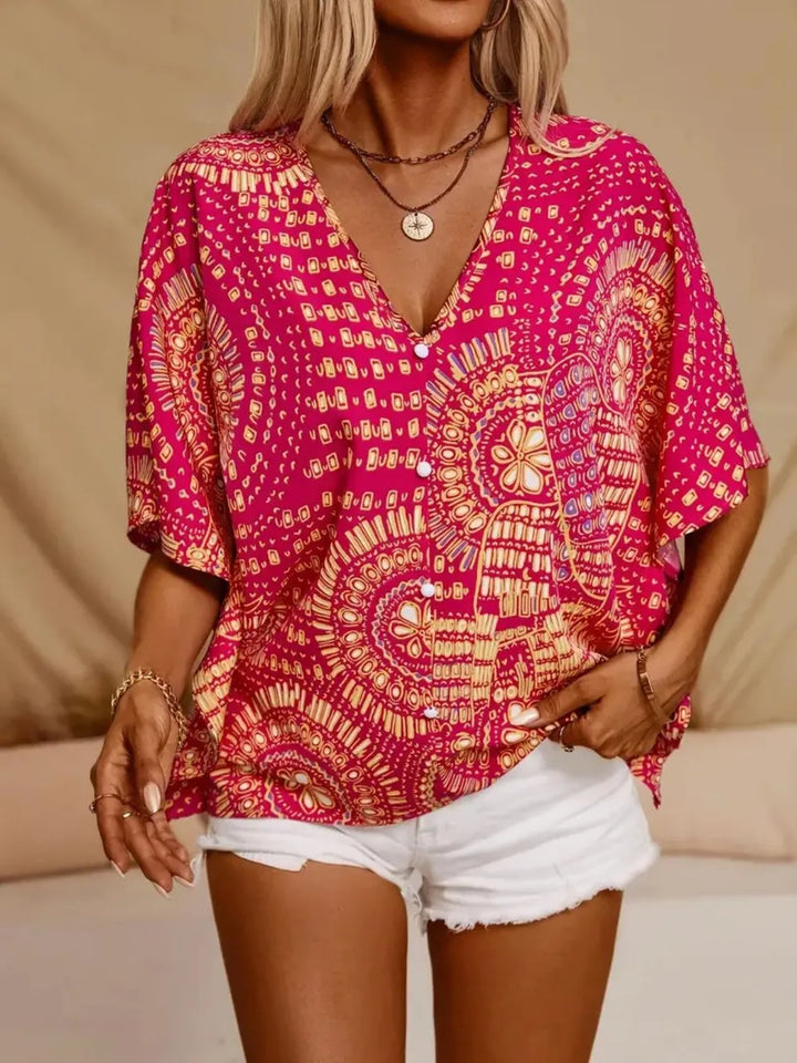 Summer style women's boho blouse, vibrant printed V-neck, relaxed fit.