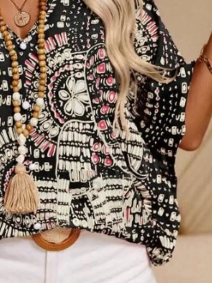Women's bohemian print V-neck shirt, relaxed and chic for casual summer days.