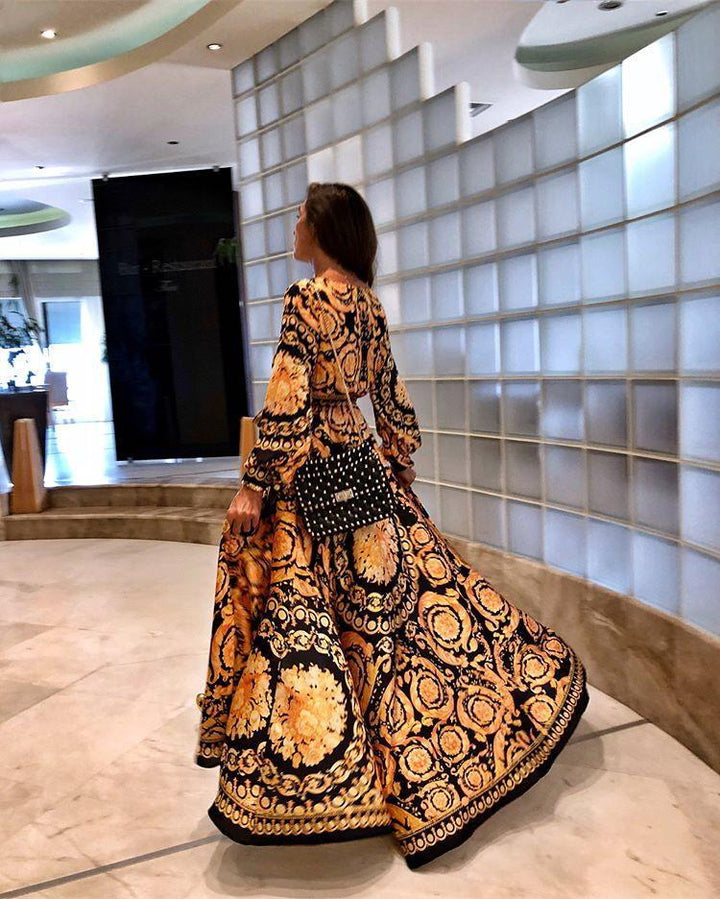 Soft women's boho maxi dress with long sleeves, wrap front, and flowy slit for summer comfort.