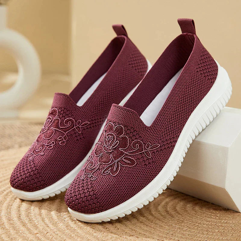 Fashionable women's BreezeWalk sandals featuring detailed embroidery and breathable design.