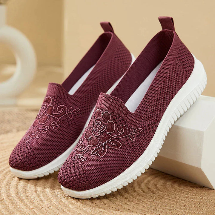 Fashionable women's BreezeWalk sandals featuring detailed embroidery and breathable design.