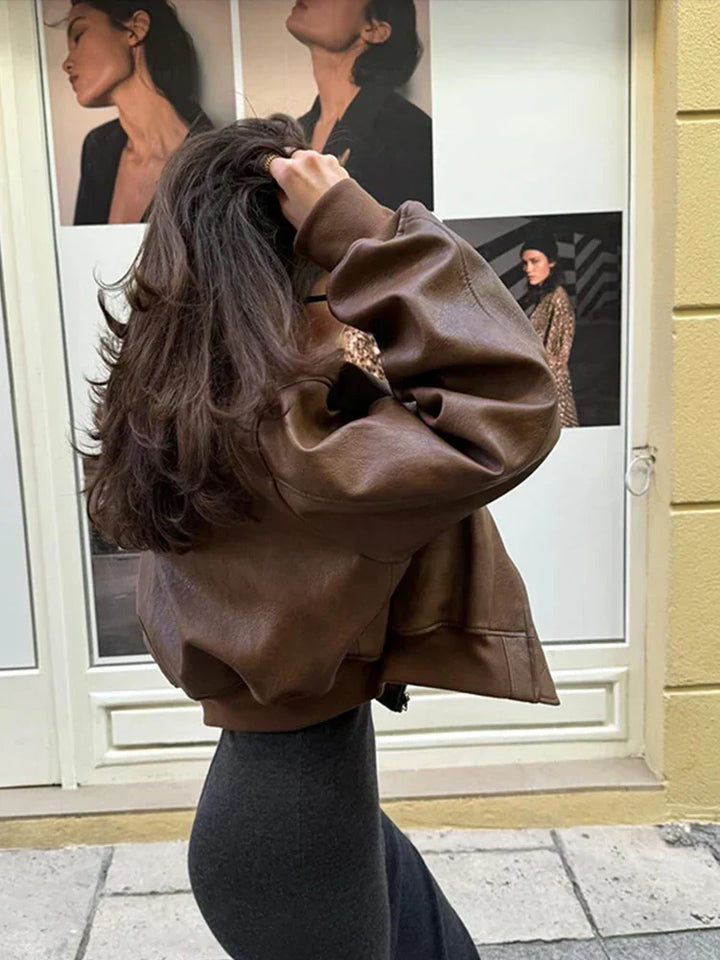 Fashionable women's vintage style cropped bomber jacket, essential brown outerwear for fall.