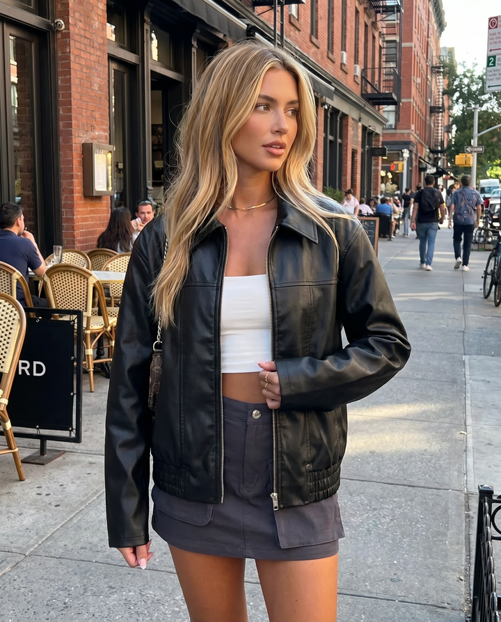 Women's casual black faux leather jacket, perfect for fall and winter style.