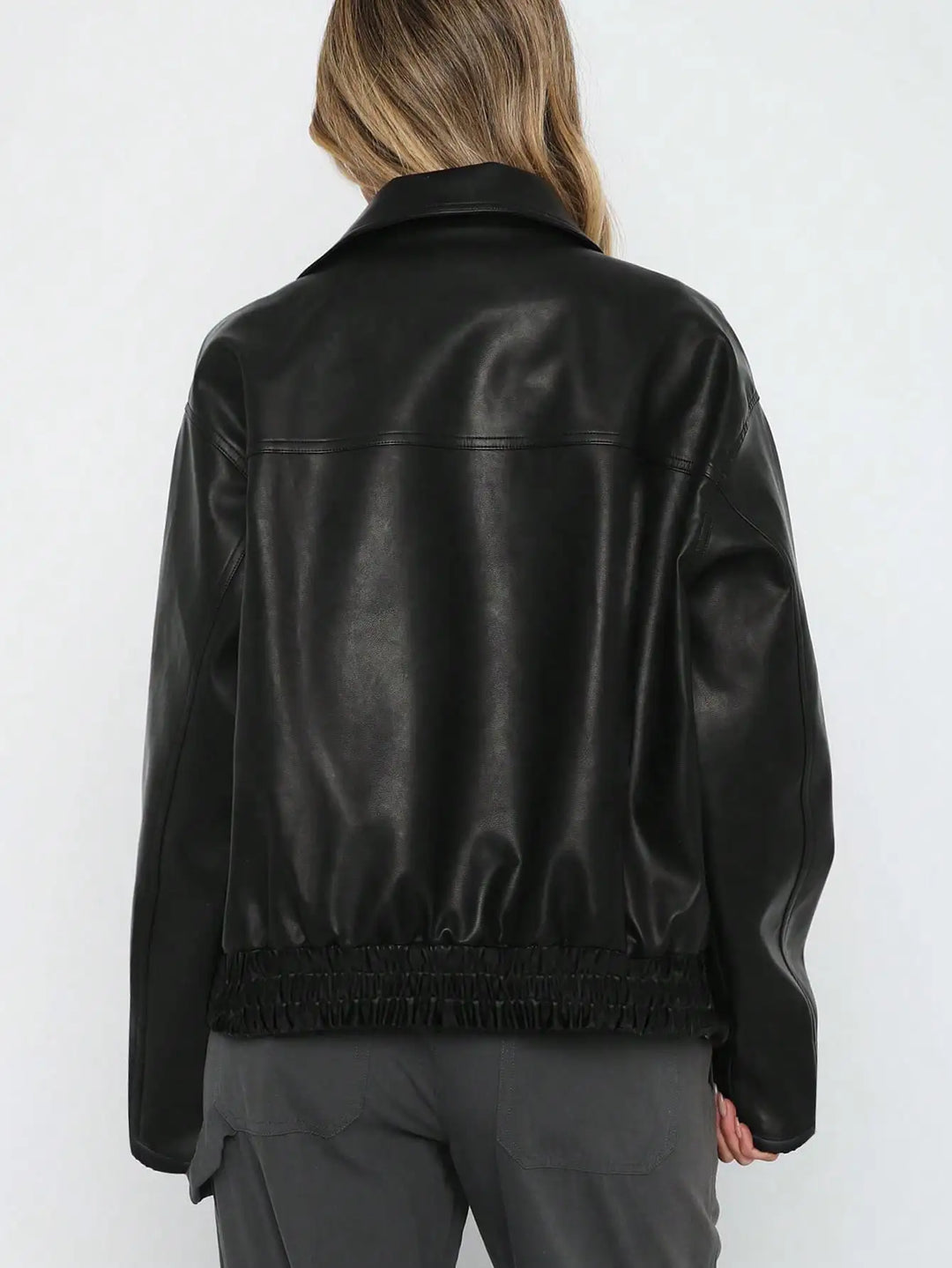 A classic black faux leather jacket for women, offering casual style and warmth for fall & winter.