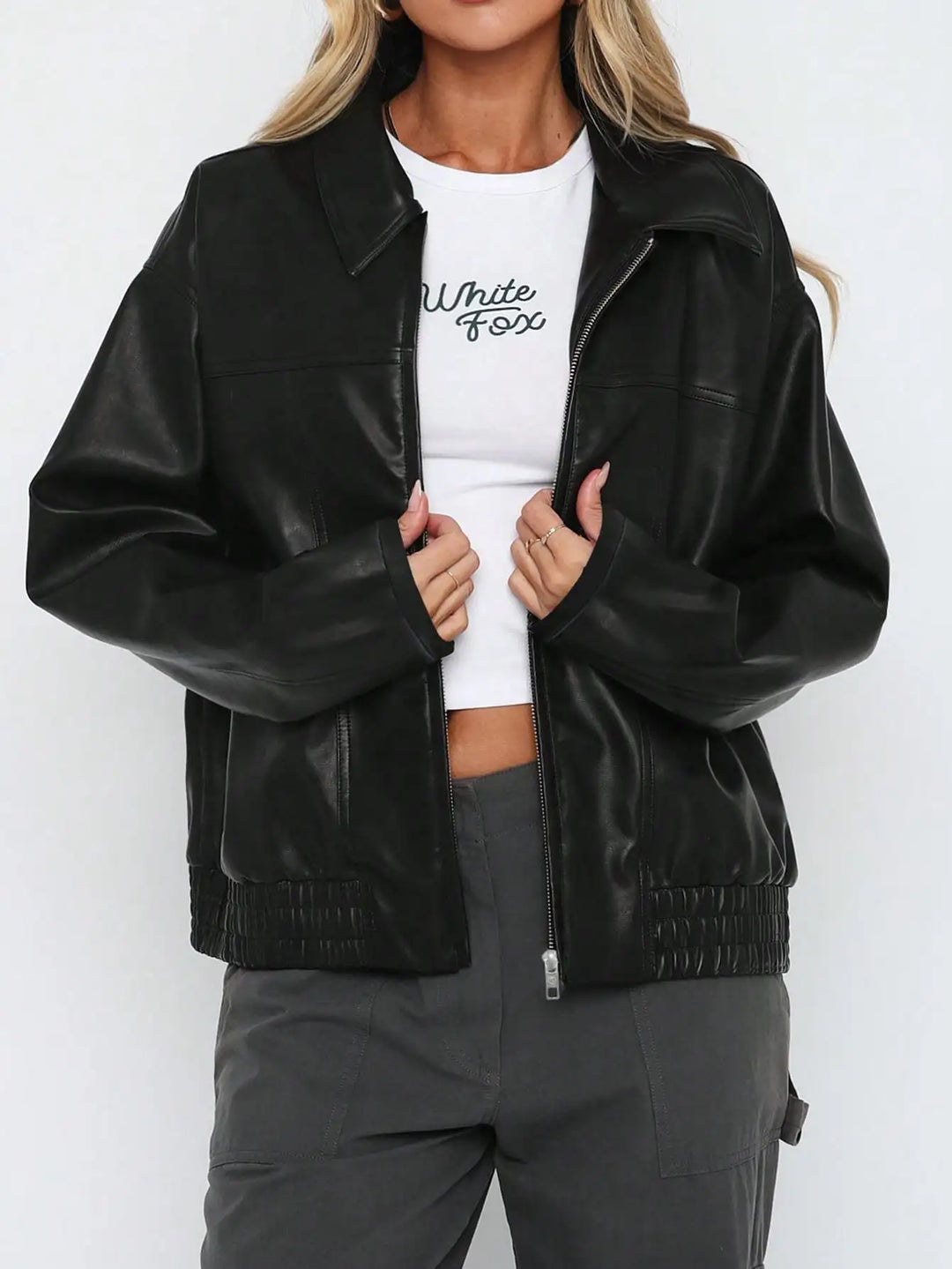 Stay stylish in this women's casual black faux leather jacket, perfect for fall and winter outfits.