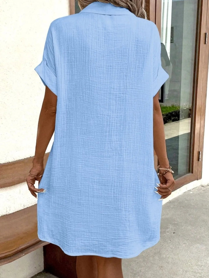 Modern women's day dress, button-down mini style with a comfortable relaxed fit and pockets.
