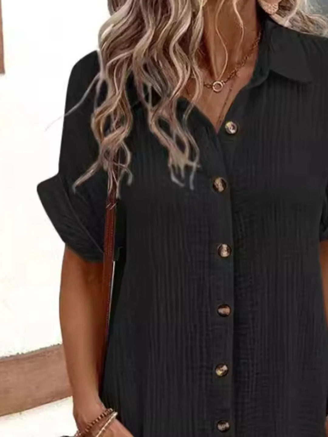 Versatile women's mini shirt dress, casual button-down style with essential pockets.