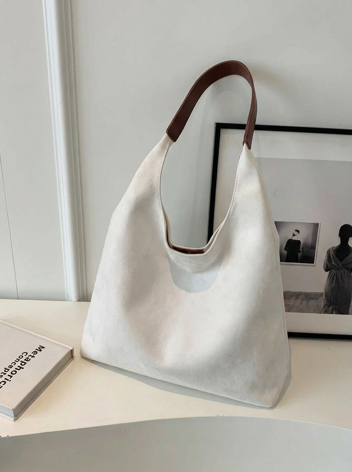 Spacious women's travel tote bag, ideal for daily use, work, & carrying all your essentials. Versatile shoulder bag.