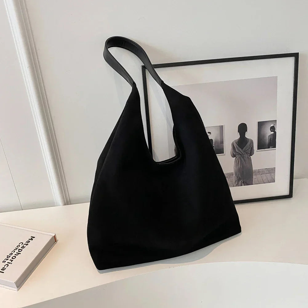Comfortable women's shoulder tote bag. Spacious interior for daily essentials, travel, or work. Casual style.