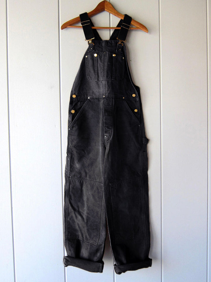Full-length shot of a women's sleeveless utility jumpsuit, a modern take on the classic dungaree, for casual fashion.