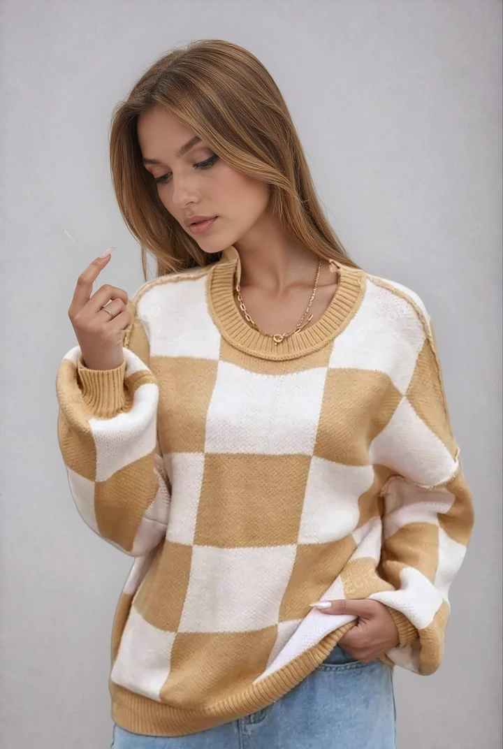 Women's checkerboard knitted sweater, oversized fit, cozy & stylish for fall fashion.