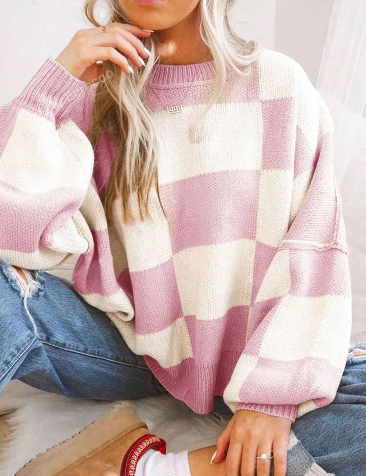 Chic women's checkerboard knitted sweater, comfortable long sleeve oversized design, fall fashion.
