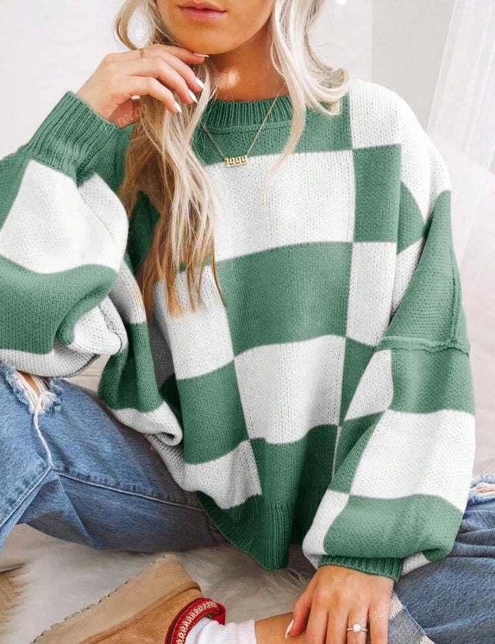 Unique women's checkerboard knitted sweater, a stylish oversized statement piece for fall fashion.