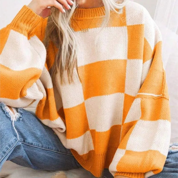Statement women's checkerboard knitted sweater, stylish oversized casual top for modern women.