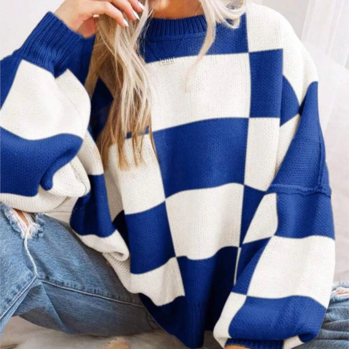 Soft knitted women's checkerboard sweater, comfortable oversized design for fall and winter fashion.