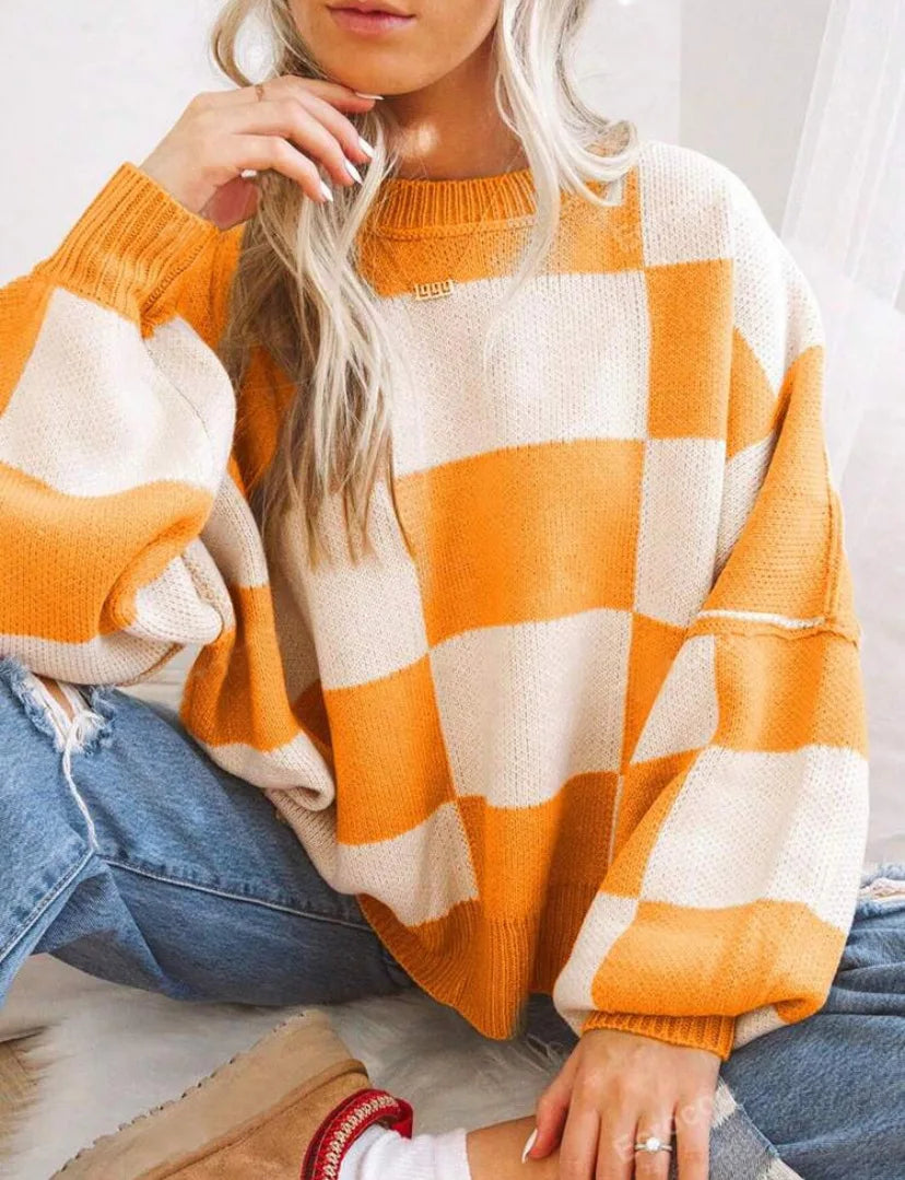Women's oversized checkerboard knitted sweater, long sleeve, perfect for stylish fall & winter fashion.