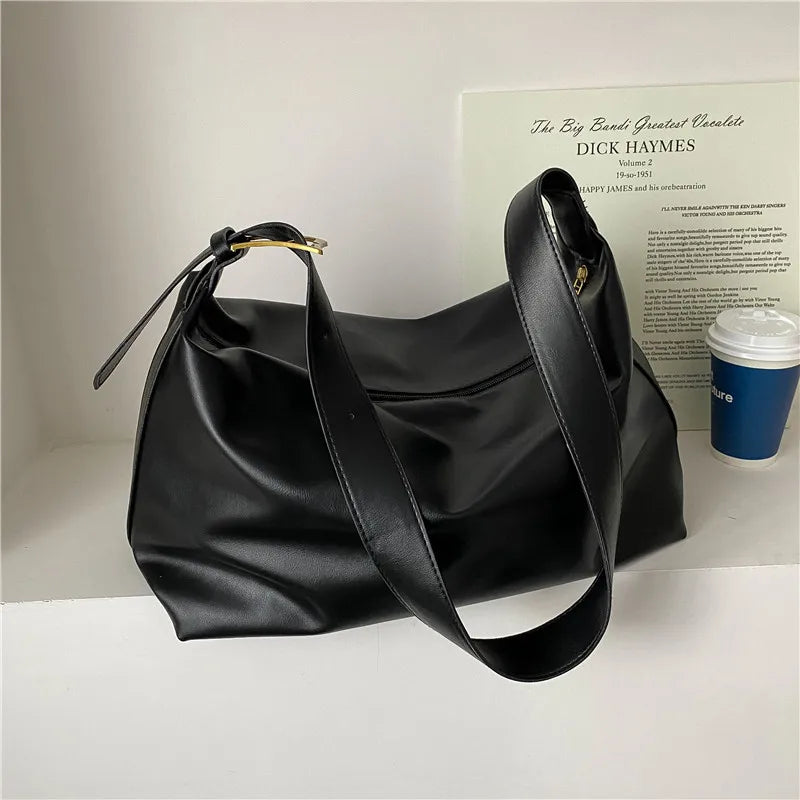 Side view of spacious women's faux leather hobo tote bag, perfect for daily essentials & style.