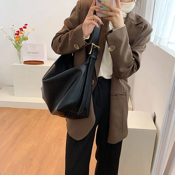 Spacious interior of a women's faux leather slouchy tote bag, ideal for organizing daily essentials.