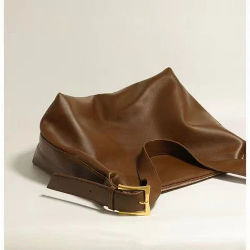 Chic black faux leather slouchy shoulder tote bag, an elegant versatile accessory for any occasion.
