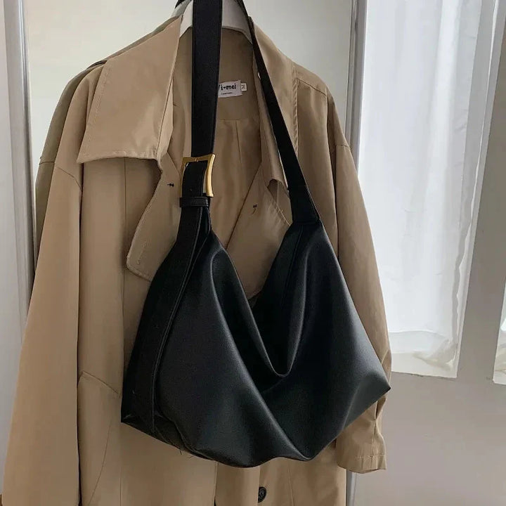 Durable bottom of a spacious faux leather women's slouchy tote bag, built for everyday use.