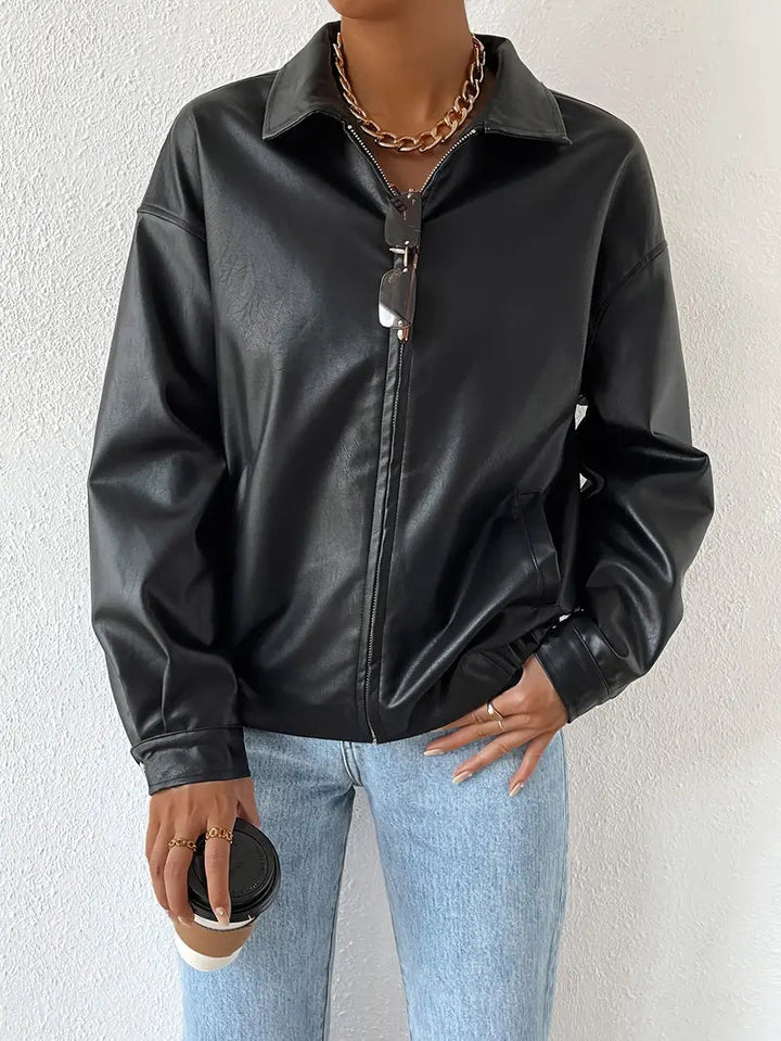Chic black zip-front moto jacket for women. Effortless style, trendy outerwear, and a versatile layering piece.